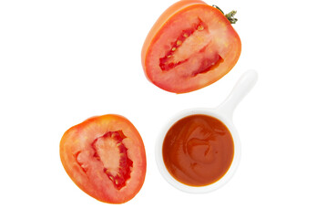 Tomato ketchup in a bowl on a white background