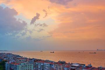 Panorama of the night city of Izmir, coastline and bay, photo from elevator tower