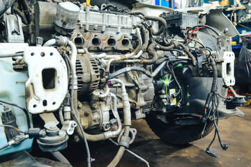 Close-up, internal combustion engine repair. The restoration of the demolished car after the accident.