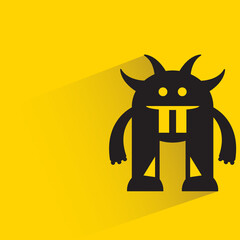 funny monster with shadow on yellow background