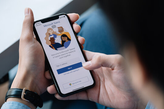CHIANG MAI, THAILAND - JAN 17, 2021 : A working from home employee is downloading the Microsoft Teams social platform, ready for remote working in isolation from home.