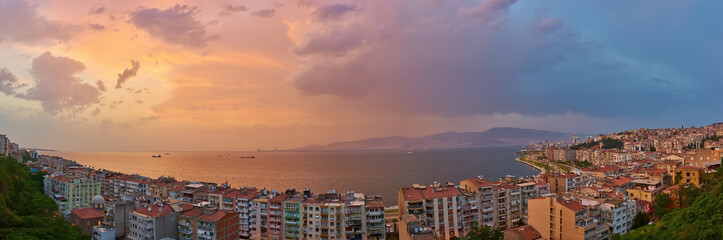 Panorama of the night city of Izmir, coastline and bay, photo from elevator tower