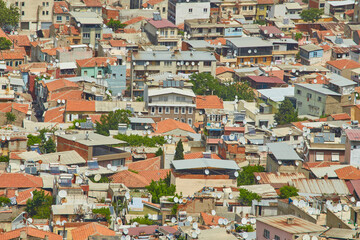 Fototapeta na wymiar colorful houses of the slum on a hill.