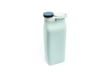 soft water bottle isolated white background. collapsible liquid container. travel equipment