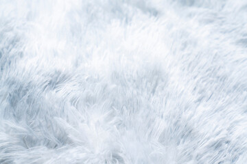 Close up white shaggy artificial fur texture or carpet for background.