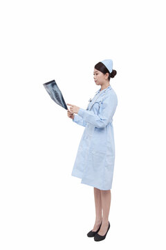 Portrait of a young doctress holding X-ray