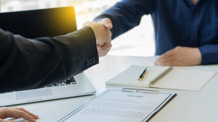 Job seekers and employers shake hands and submit resume for job interviews. Quality employment concept