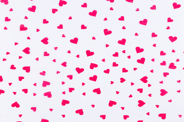 Fototapeta na wymiar Red hearts on white . Minimal Valentines day background.