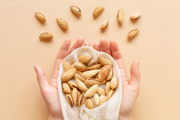 The concept of Zero waste. Reusable bag with nuts. Ecology and conservation of environment.