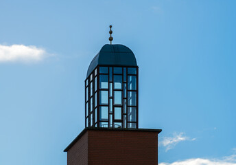 Fototapeta na wymiar Detail of a building with glass tower 