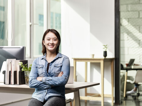 portrait of a successful young asian business woman entrepreneur 