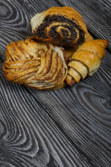 Cinnamon and poppy seed buns. Rich pastries. Close-up shot.