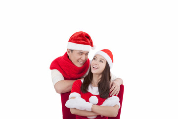 Portrait of young couple wearing Santa hats,smiling
