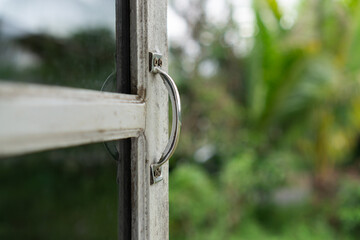 Window handle with blurred background.