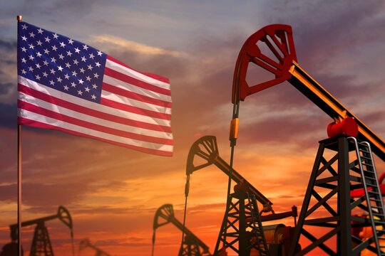 USA oil industry concept. Industrial illustration - USA flag and oil wells with the red and blue sunset or sunrise sky background - 3D illustration