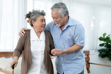 Obraz premium Asian elderly couple, Taking care of health in retirement, Elderly man carefully takes care of old woman.