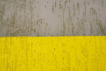 Old grunge texture, grey concrete wall. Colors yellow and gray , Color of the year of 2021. Illuminating , Ultimate Gray.