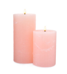 Burning pink wax candles on white background