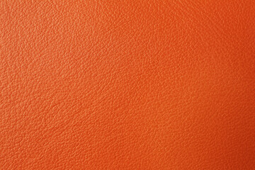 Texture of orange leather as background, closeup