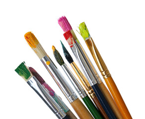 Obraz premium Different brushes with paints on white background