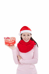 Portrait of young woman wearing Santa hat,holding gift
