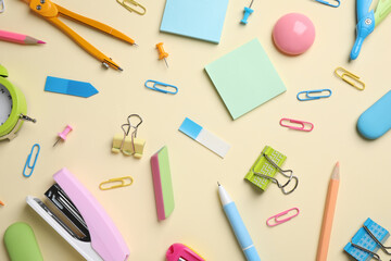 Different stationery on yellow background, flat lay