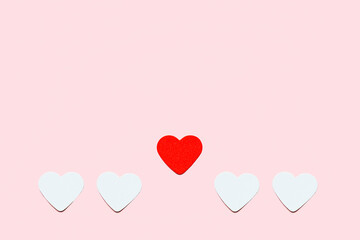 Fototapeta na wymiar Hearts on a pink background. Valentine's day concept.