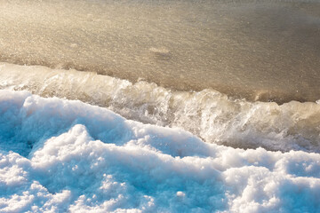 Ice sea water waves and snow abstract background photo