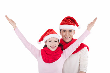 Portrait of young couple wearing Santa hats,smiling
