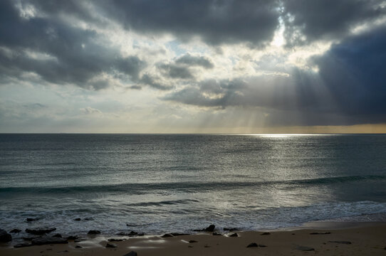 Seascape with sunbeams over Atlantic ocean on Tarifa coast