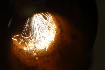sparks during laser cutting of metal pipe on cnc laser cutting machine