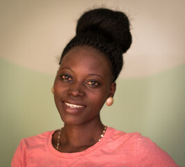 Young candid black African woman portrait in indoors