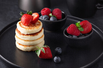 Tasty cheese pancakes with fresh berries. Healthy breakfast or lunch - Image