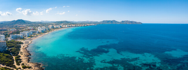 An aerial panorama on Cala Millor beach on Mallorca island in Spain at evening time