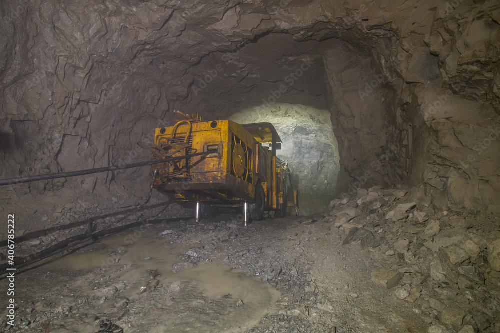 Wall mural drilling machine sandvik in underground gold mine tunnel