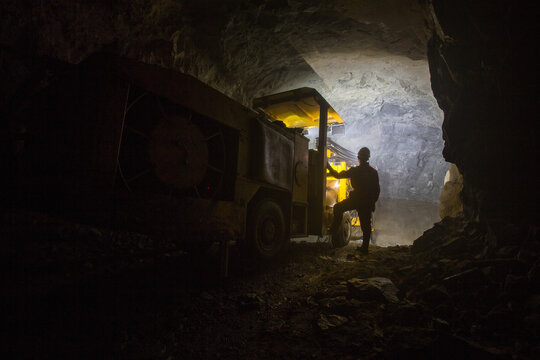 Drilling machine Sandvik in underground gold mine tunnel
