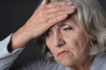 Fototapeta premium Close up portrait of sad senior woman