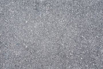 The texture of the gray asphalt pavement. Asphalt empty space.