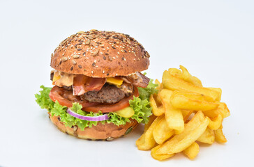 burger with melted cheese, ham, tomatoes and fried onions