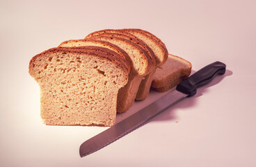 Sliced toast breads and bread knife isolated