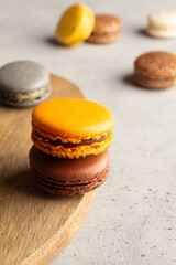 multicolored macarons on a light gray background