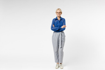 Full length blonde successful confident employee business woman 40s wearing blue classic shirt gray pants glasses formal clothes hold hands crossed folded isolated on white background studio portrait. - obrazy, fototapety, plakaty