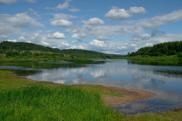 Fototapeta na wymiar calm northern river on a clear sunny summer day.