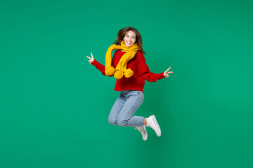 Full length of cheerful funny young brunette woman 20s in casual knitted red sweater yellow scarf...