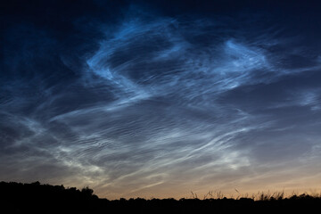 Noctilucent silver clouds on the sky