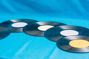 Vinyl records on blue background. Vintage concept
