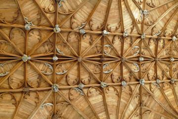 Close-up of the beautiful wooden carvings of the ceiling of an English church
