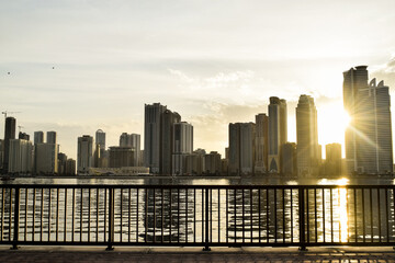 Khalid Lake, Sharjah skyline and a beautiful sunset. Sharjah, United Arab Emirates.