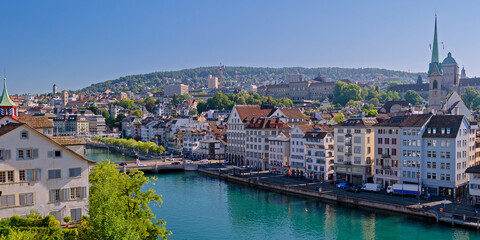 Fototapeta na wymiar Zurich waterfront scene viewed from above with the East bank of the Limmat River and old town architecture