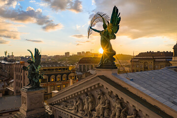 Sculpture of fame with palm branch on Lviv opera house, Ukraine from drone